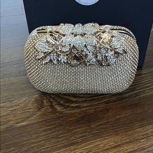 Elegant Gold Clutch with Floral Design